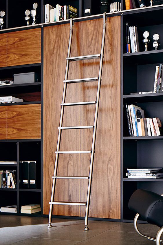 a ladder leaning up against a book shelf