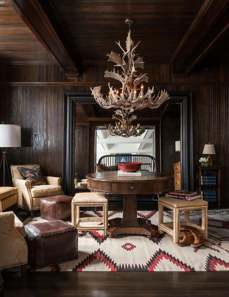 a living room filled with furniture and a chandelier