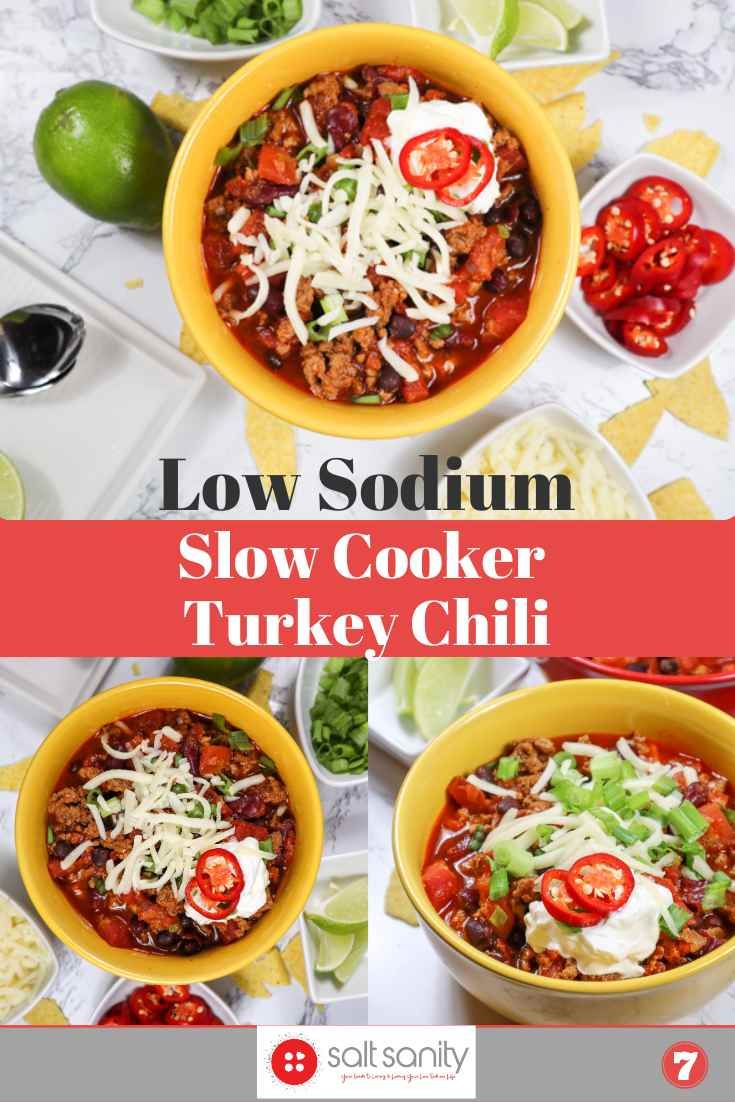 slow cooker turkey chili recipe in two bowls with limes and tomatoes on the side