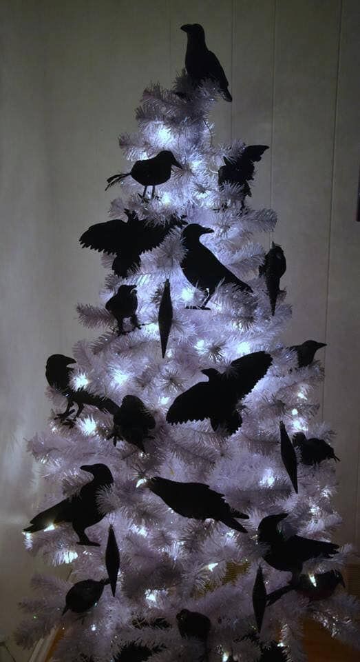 a white christmas tree with black birds on it