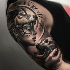 a man's half sleeve with a clock and wolf on the arm, holding a skull