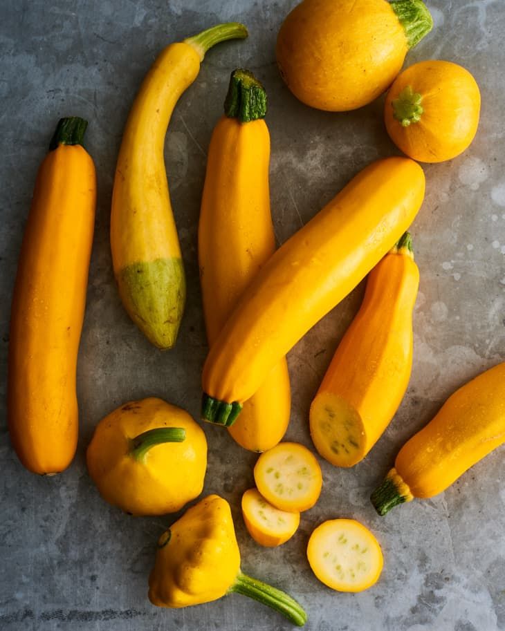 squash and zucchini are on the table next to each other