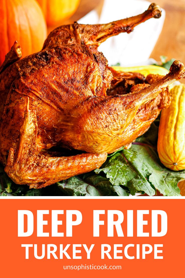 a roasted turkey on a bed of lettuce and pumpkins with the words deep fried turkey recipe