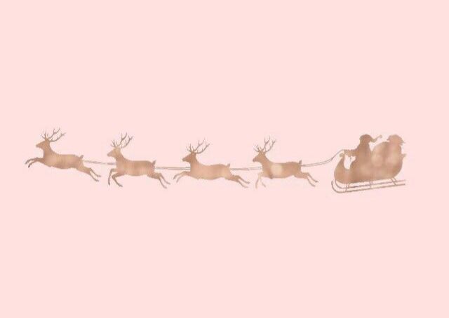 santa's sleigh with reindeers flying through the sky on a pink background