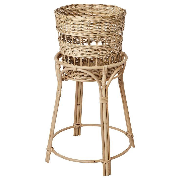 a wicker stool with a round seat and back rest on an isolated white background