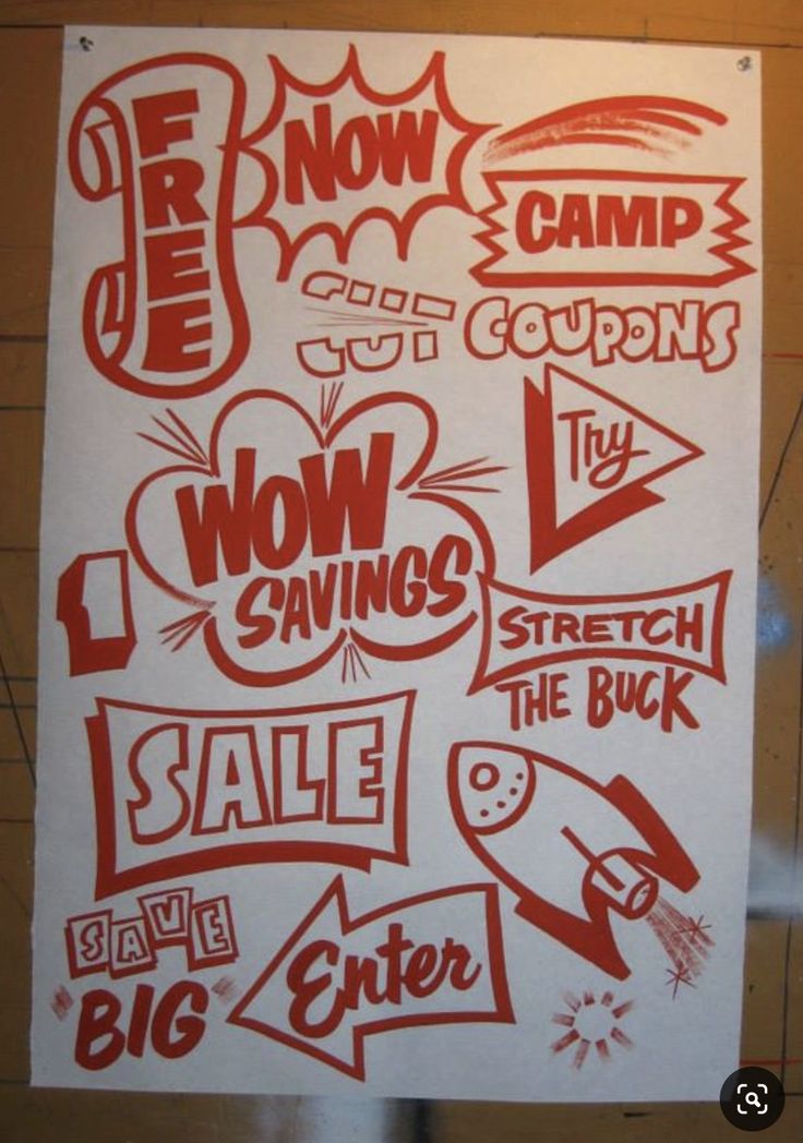 a bunch of stickers are on the wall next to a sign that says wow savings, sale, and big enter