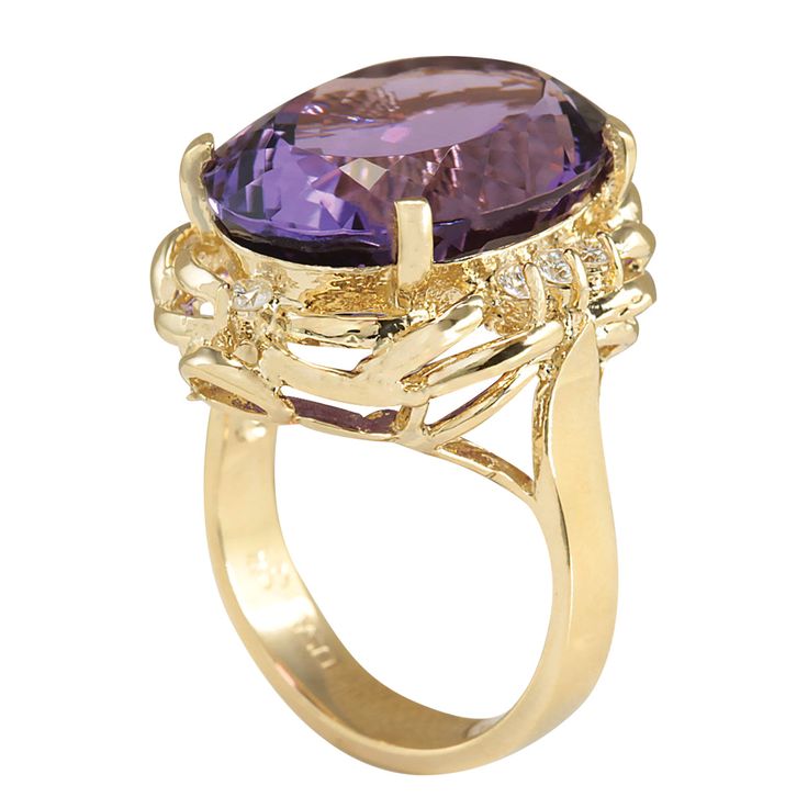 a gold ring with an amethorate and diamonds