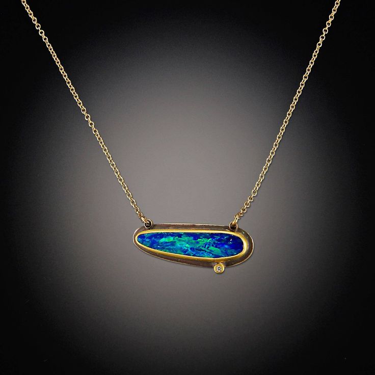 This vibrant necklace features a magical Australian opal, accented with a twinkling diamond dot. The stones are wrapped in 22k gold, backed with sterling silver, and float on a 14k gold chain. Pendant measures approximately 3/4" wide. Matte finish. Each stone is unique and may vary slightly from image. Gold Chain Pendant, Australian Opal Jewelry, Necklace With Diamond, Australian Gold, Inlay Jewelry, Wire Jewellery, Opal Pendant Necklace, Art Jewelry Contemporary, Tourmaline Jewelry