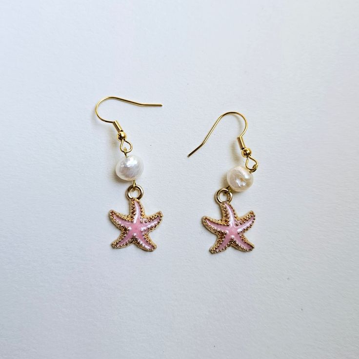 These pearl and shell earrings are light and dainty.  With hints of gold and pink, these ocean themed earrings evoke warm summer sunsets by the sea.  --VARIATIONS:  If you know that you are allergic to stainless steel, there is an option to choose titanium ear wires, which are less likely to cause an allergic reaction.  Just leave a note that you would prefer the titanium earwires.  --SHIPPING TIME: 3-5 business days. Please be aware that USPS shipping times are slower than usual at the moment. Ocean-inspired Shell Pearl Earrings Gift, Ocean-inspired Shell Earrings With Ear Wire, Ocean Themed Earrings, Ocean-inspired Shell Jewelry With Matching Earrings, Ocean-inspired Shell Drop Earrings For Summer, Ocean-inspired Dangle Shell Earrings, Starfish Earrings, Beach Earrings, Allergic Reaction