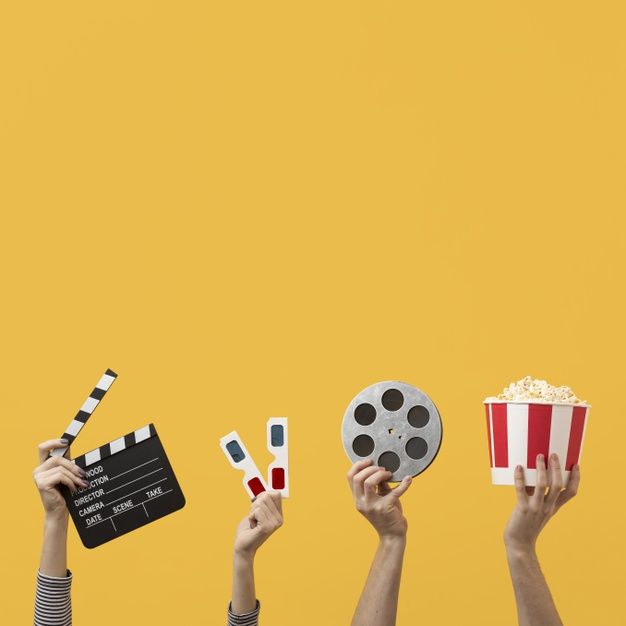 people holding up clapsticks and popcorn in front of a yellow background