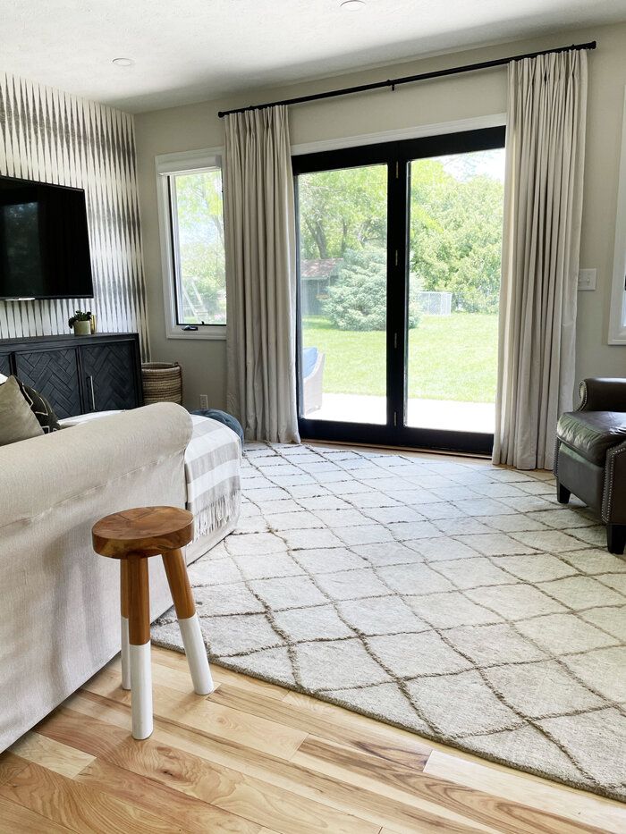 a living room with sliding glass doors leading to a patio