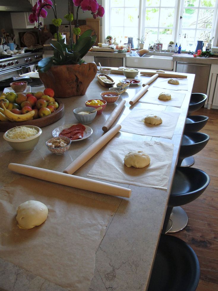 the table is covered with food and ready to be cooked in the oven for dinner