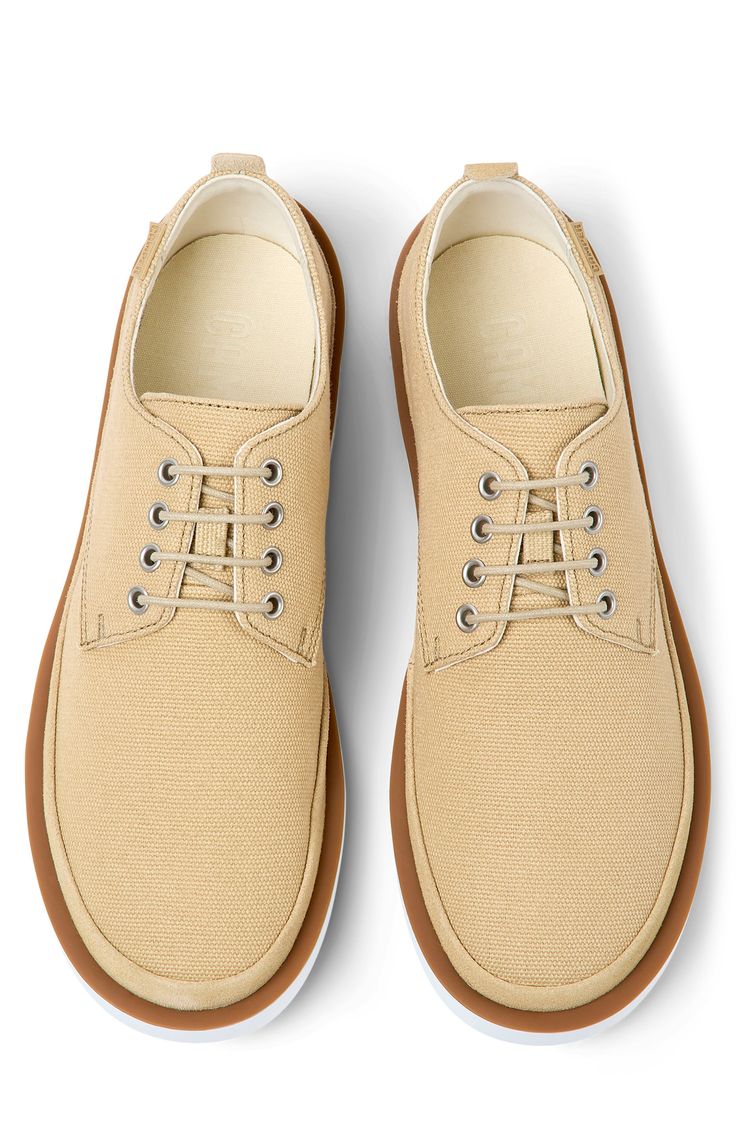 A lightweight, flexible outsole enhances the everyday appeal of a lace-up sneaker with a clean, classic profile. OrthoLite® Recycled™ footbed Textile and leather upper and lining/synthetic sole Imported Casual Lace-up Oxfords With Contrast Sole, Classic Beige Sneakers With Textured Sole, Casual Beige Slip-on Oxfords, Modern Walking Shoes With Textured Sole, Casual Lace-up Shoes With Removable Insole, Canvas Sneakers With Stitched White Sole, Classic Walking Shoes With Textured Sole And Plain Toe, Oxford Lace-up Shoes With Textured Sole, Casual Oxfords With Textured Sole