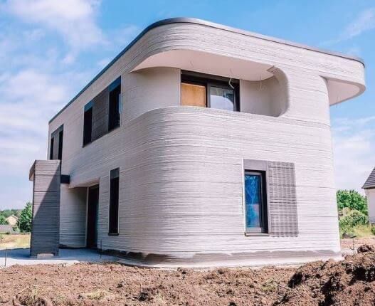 an unusual house is built on top of dirt