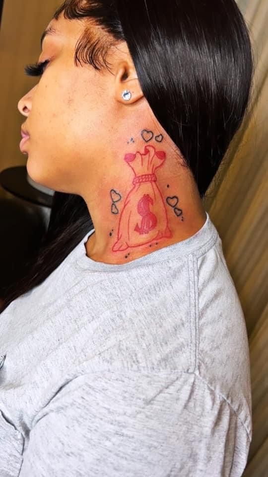 a woman with a tattoo on her neck