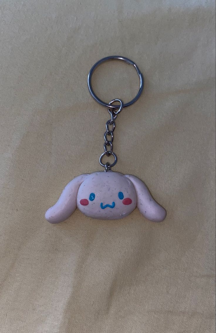 a keychain with an image of a bunny on it's face and eyes