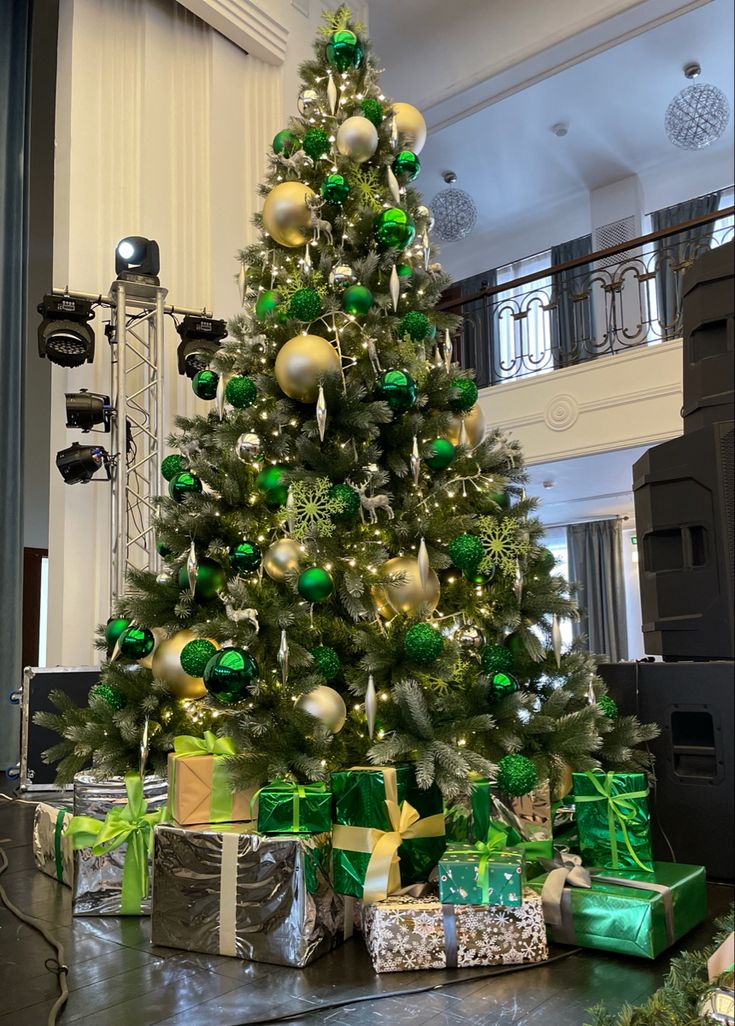 a decorated christmas tree with presents under it