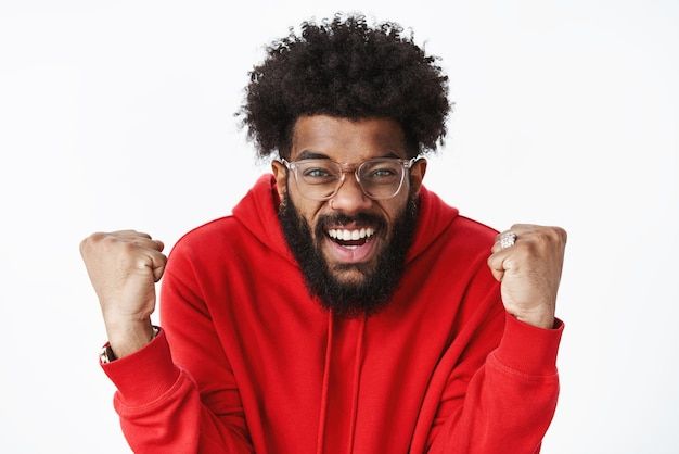 a man in a red hoodie with his fists up