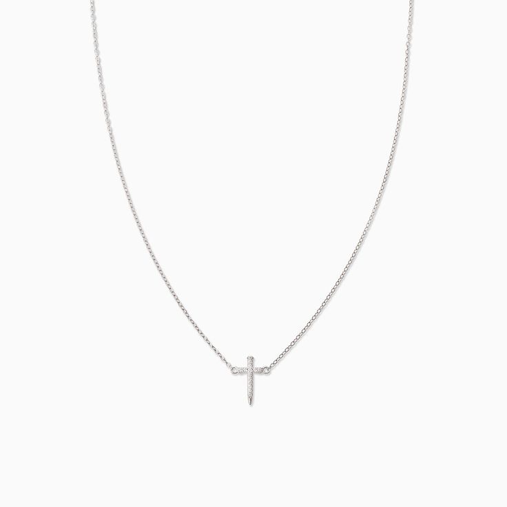 It’s not a T necklace, it’s our Simple Cross Necklace. Featuring a dainty, simple chain necklace and a pavé cross, this is the necklace your everyday look has been missing. Want to know the best part? Not only does this cross necklace come in gold, but you can also get it in Sterling Silver. Minimalist Cross Pendant Necklace For Everyday, Minimalist Cross Pendant Necklace For Everyday Wear, Everyday Cross Pendant Clavicle Necklace, Minimalist Clavicle Chain Necklace With Cross Pendant, Everyday Clavicle Chain Necklace With Cross Pendant, Dainty Cross Necklace For Everyday Wear, Minimalist Cross Charm Necklace With Delicate Chain, Minimalist Cross Chain Necklace With Delicate Chain, Minimalist Delicate Chain Cross Necklace