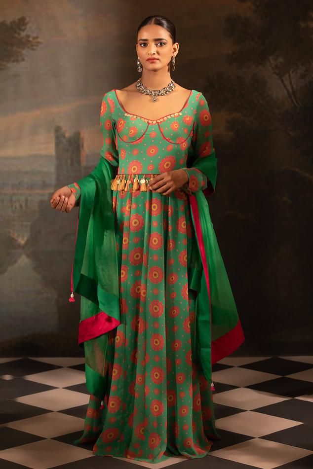 Green padded anarkali with botanical print and mirror, thread, pearl, bead, gota embroidered neckline. Paired with dupatta.
Components: 2
Pattern: Printed, Embroidery
Type Of Work: Floral, mirror, thread, pearl, bead, gota
Neckline: Notched
Sleeve Type: Churidar sleeves
Fabric: Georgette, Organza, Lining: Crepe
Color: Green
Other Details: 
Anarkali Length: 60 inches
Back tassel tie-up knot
Tassel bordered sheer dupatta
Occasion: Sangeet - Aza Fashions Mughal Theme Dress, Festive Anarkali Choli, Unstitched Bollywood Anarkali Set With Traditional Drape, Traditional Designer Anarkali Set With Dupatta, Designer Green Cotton Silk Anarkali Set, Anarkali Cotton Silk Dress With Sheer Dupatta, Transitional Green Anarkali Sharara, Unstitched Pista Green Anarkali Set, Bollywood Churidar With Sheer Dupatta For Transitional Seasons