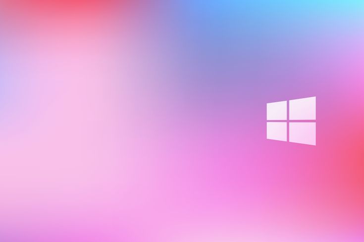 a blurry image of a window on a pink and blue background with the windows logo