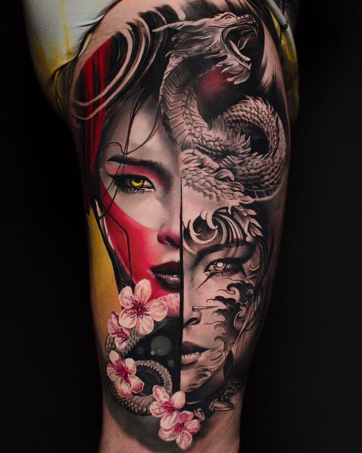 a woman with dragon and snake tattoo on her leg