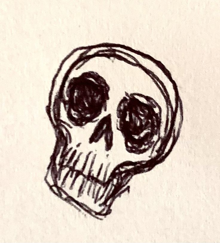 a black and white drawing of a skull