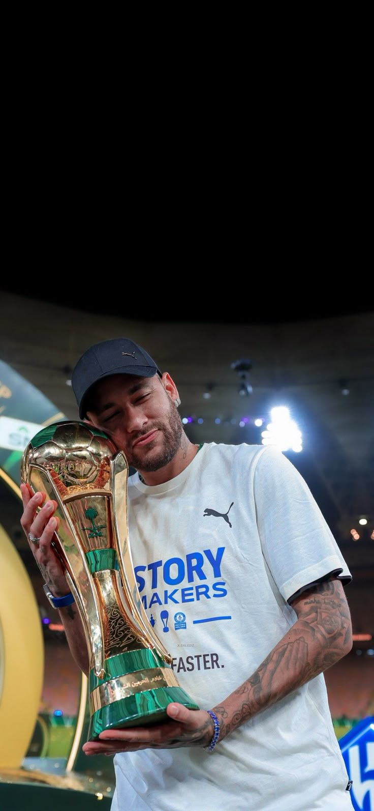 a man holding a trophy in his hands