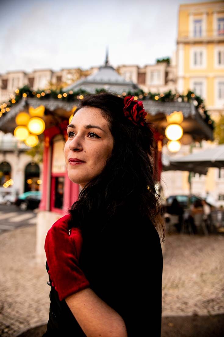 a woman standing in front of a gazebo