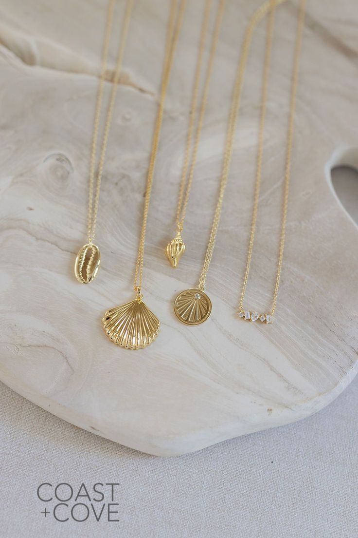 This beautiful Gold Sanibel Necklace is crafted from 14k gold vermeil and shaped like a flat scallop shell. Our gold jewelry pieces are durable and made to layer and stack. Style this as a simple everyday necklace, or layer it in a gold necklace stack. However you style it, this piece is a timeless reminder of the beauty of the ocean. Elegant Sterling Silver Shell Jewelry, Elegant Shell Pendant As A Gift, Elegant Shell Pendant As Gift, Elegant Shell Pendant For Gift, Ocean-inspired Yellow Gold Jewelry, Elegant Yellow Gold Shell Jewelry, Elegant Jewelry With Oyster Bracelet, Elegant Gold Plated Shell Jewelry, Elegant Gold Charm Necklace For Beach