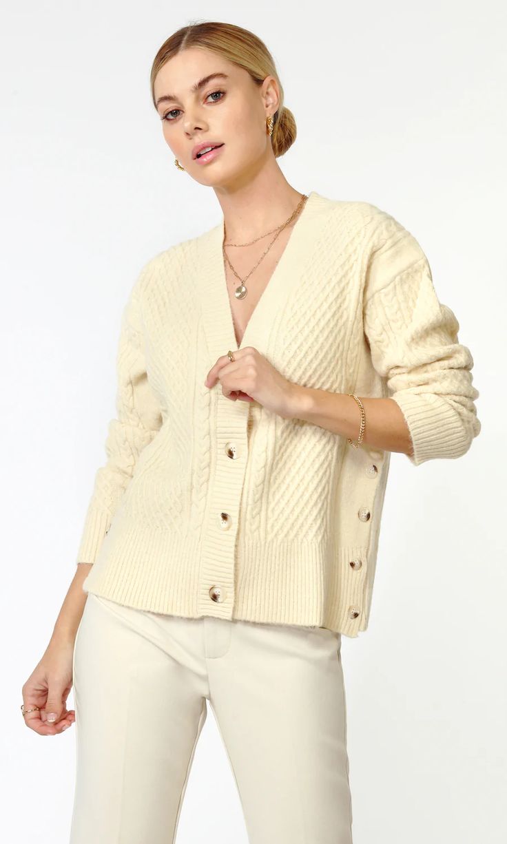 The perfect cardigan is featured in a classic cable knit design with button-front closure and buttons along the sides for added dimension. Oversized cardigan  Cable knit  Long sleeves Length: 23" Chest: 20 1/4" Self: 50% Acrylic, 27% Polyester, 23% Nylon Hand wash in cold water with similar colors. No bleach. Dry flat. Zyla Colors, Perfect Cardigan, Knitwear Sweater, Oversized Knit Cardigan, Luxury Women Fashion, Light Spring, Oversized Cardigan, Versatile Dresses, Seasonal Fashion