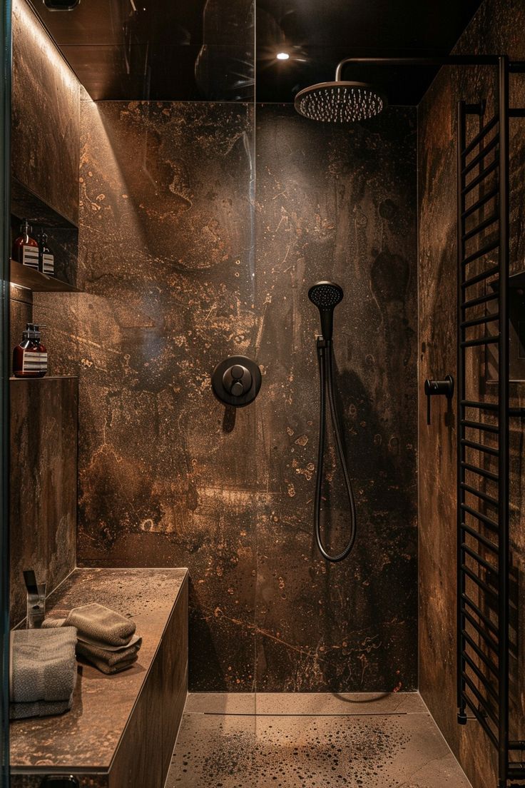 a bathroom with a walk in shower next to a wooden counter top and brown walls