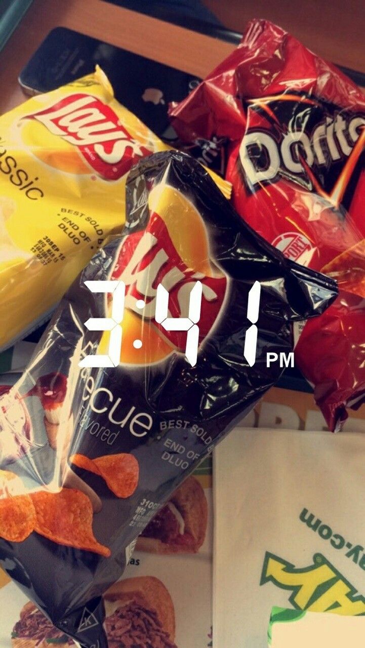 some chips and other snacks are sitting on a table