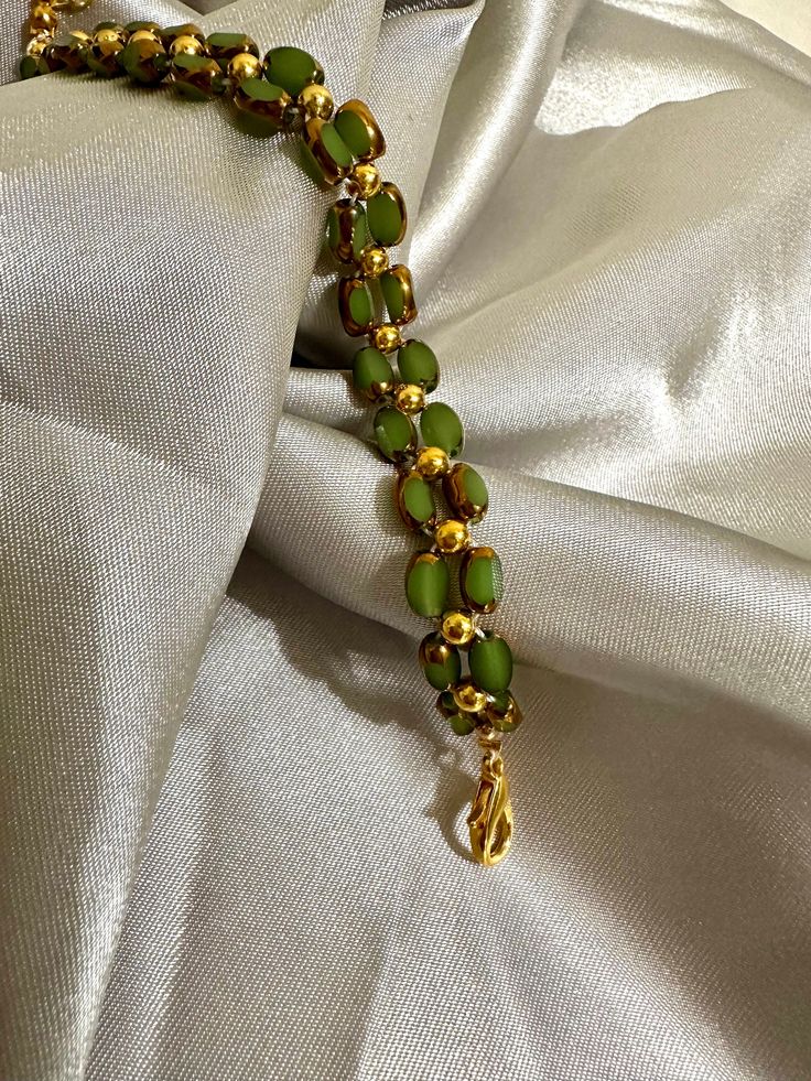 Our delicate bracelet is very suitable for daily wear.It can be also be given to girlfriends,daughters,mothers,stepmom,or as a birthday gifts to friends.  🦋Main materials :  Green beads,3mm 14k gold plated round beads 🦋My bracelets is about 6-7 inches without extension chain so they can be suitable for most people's wrist,and if you had big wrist,still no problem with 2.5 inches extension  🦋About packaging: Our bracelet is packaged in a simple white box. 🦋About shipping: we ships the order next day, If you have any question,please feel free to contact me. 🦋Thank you for visiting my shop, I hope you enjoy your jewelry as much as we enjoy making it for you. Please visit my shop page for many more exciting items. Check back frequently as new designs are added regularly.    https://assali Bohemian Single Strand Gold Beaded Bracelet, Gold Single Strand Spiritual Bracelet, Green Jade Bracelet For Wedding, Jade Bracelets With Spacer Beads As Gift, Adjustable Single Strand Green Beaded Bracelets, Adjustable Green Single Strand Beaded Bracelets, Hand-strung Jade Bracelets In Gold, Hand-strung Gold Jade Bracelets, Green Spiritual Jewelry With Tiny Beads