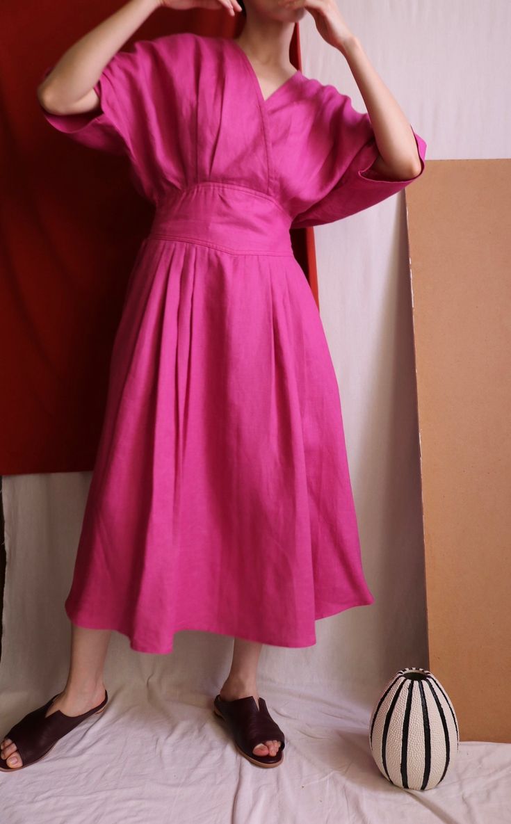 Details Linen faux-wrap dress with basque waist (semi-elasticated). No lining.Made-to-order. Ship in 15-18 days.  Color/Couleur: Raspberry Pink( Please convo us for more colour options.) Material:100% linen  Size/Taille:  Made-to-measure. Please provide bust/waist/hips size and height during checkout.  Length:115cm  Model is 163 cm/ 47kg with 33' bust/ 25' waist/35'  hips.  Care instructions/Entretien:Cold handwash and air-dry. Do not soak. Follow us on instagram (@metaformose) for all the lates Spring V-neck Box Pleat Dress, Spring V-neck Dress With Box Pleat, Summer Dresses With Pleated Sleeves In Relaxed Fit, Summer Dresses With Pleated Sleeves And Relaxed Fit, Knee-length Box Pleat Pleated Summer Dress, Chic Summer Midi Dress With Box Pleat, Summer Knee-length Box Pleat Pleated Dress, Spring Linen Pleated Dress, Summer Linen Dress With Pleated Waist