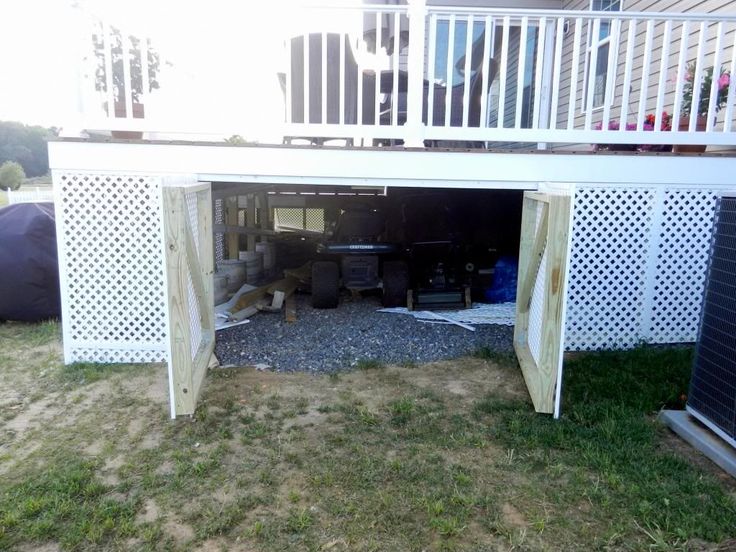 an open garage door on the side of a house