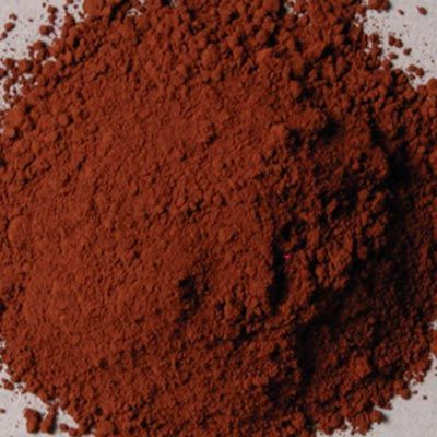 a pile of red clay sitting on top of a white table