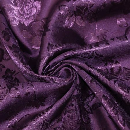 an image of purple fabric with flowers and leaves on it, as well as the background