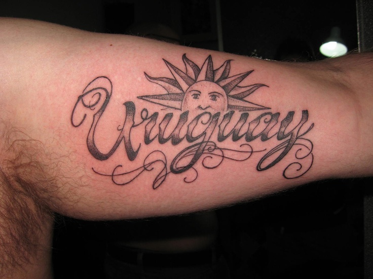 a man with a tattoo on his arm that says crazyway in cursive writing