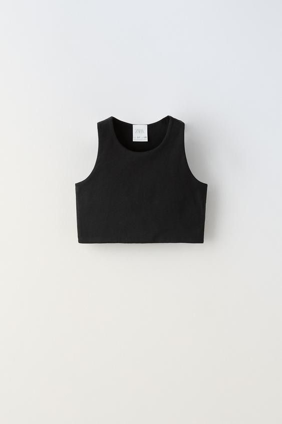 SLEEVELESS CROP TOP - White | ZARA United States Chic Stretch Sleeveless Crop Top, Trendy Sleeveless Stretch Crop Top, Trendy Stretch Sleeveless Crop Top, Chic Seamless Fitted Crop Top, Chic Crew Neck Crop Top, Casual Cropped Vest Crop Top, Zara Tank Top Vest, Trendy Fitted Sleeveless Crop Top, Chic Seamless Crop Top Tank