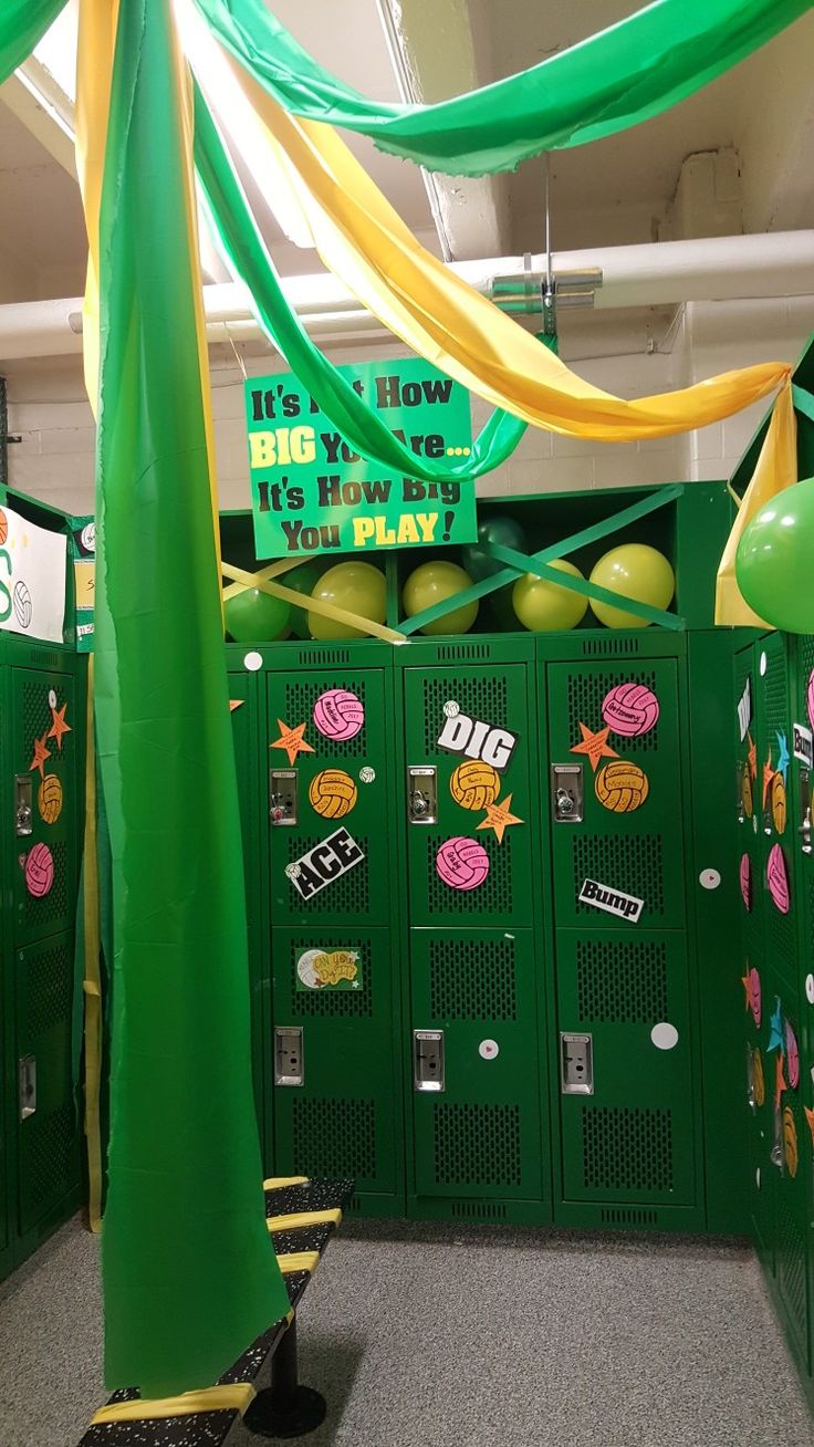 the lockers are decorated with green and yellow ribbons, balloons, and signs that read it's how to play