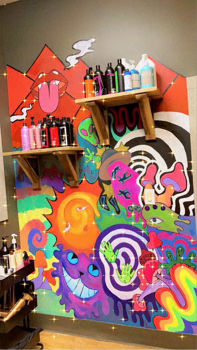 a colorful mural on the side of a wall in a room with shelving and shelves