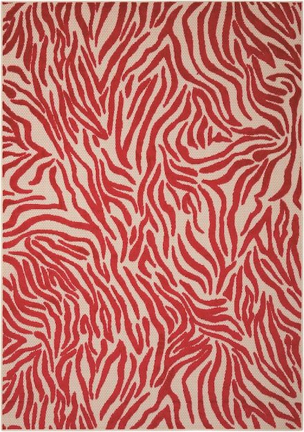 a red and white rug with zebra print