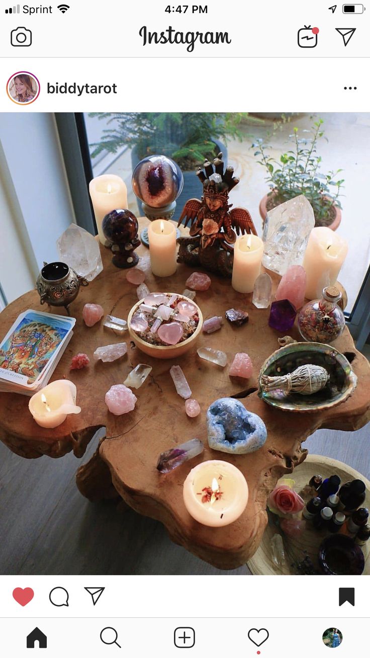 a table with candles and rocks on it