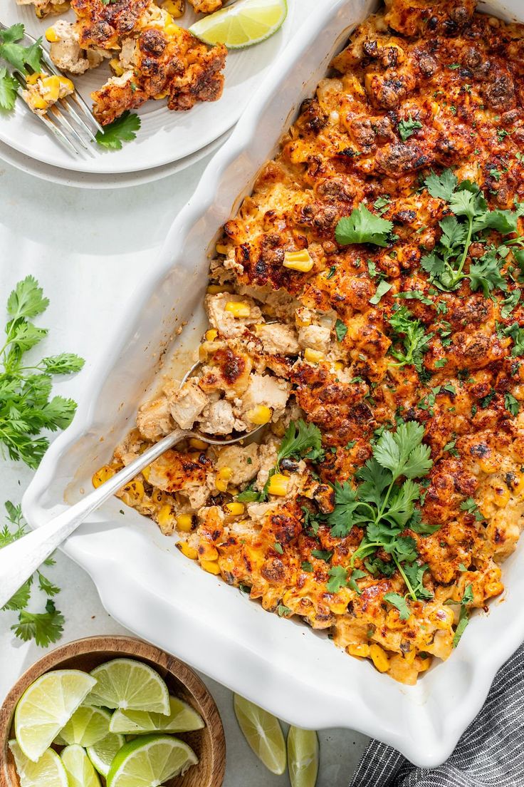 a casserole dish with chicken, corn and cilantro garnish