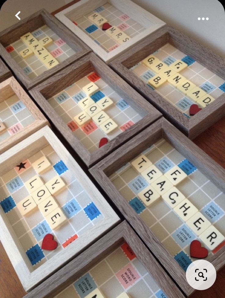 several scrabble tiles are arranged on the floor