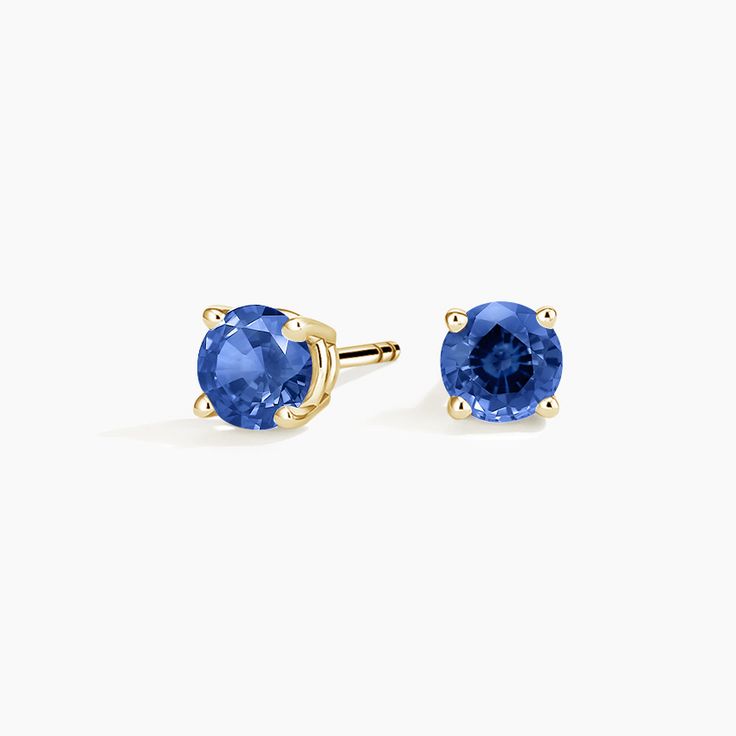 Solitaire Sapphire Stud Ears - 18K Yellow Gold. A beautifully matched pair of brilliant blue sapphires are secured in classic four-prong basket settings with comfortable push back posts for pierced ears. Yellow Gold Sapphire Earrings, Gold Sapphire Earrings With Prong Setting, Classic Blue Sapphire Earrings, Classic Blue Lab-created Sapphire Earrings, Classic Yellow Gold Jewelry With Lab-created Sapphire, Classic Yellow Gold Lab-created Sapphire Jewelry, Anniversary Yellow Gold Sapphire Earrings, Classic Blue Brilliant Cut Earrings, Classic Sapphire Birthstone Earrings