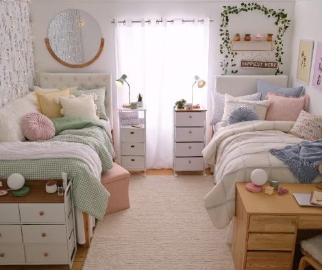 a bedroom decorated in pastel colors and white