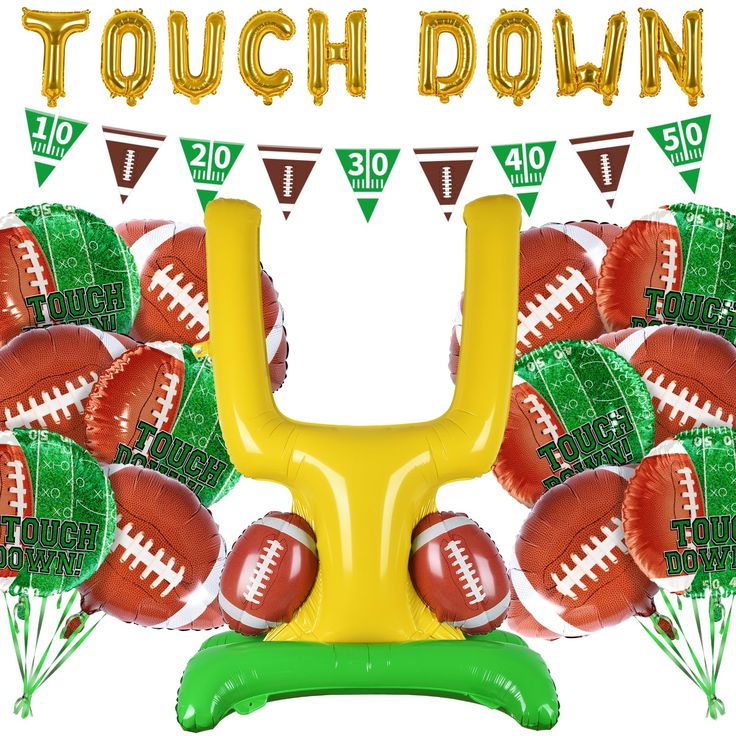 an inflatable football arrangement with the words touch down above it and balloons surrounding it