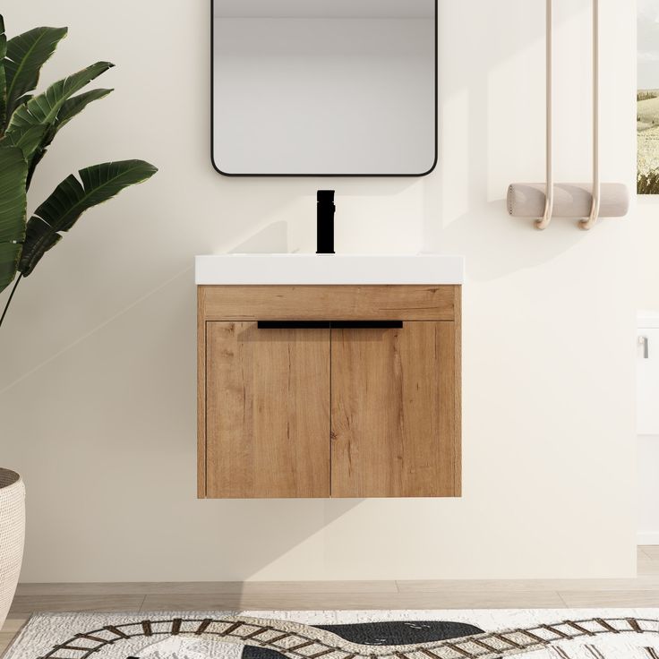 a bathroom with a mirror, sink and plant on the floor in front of it